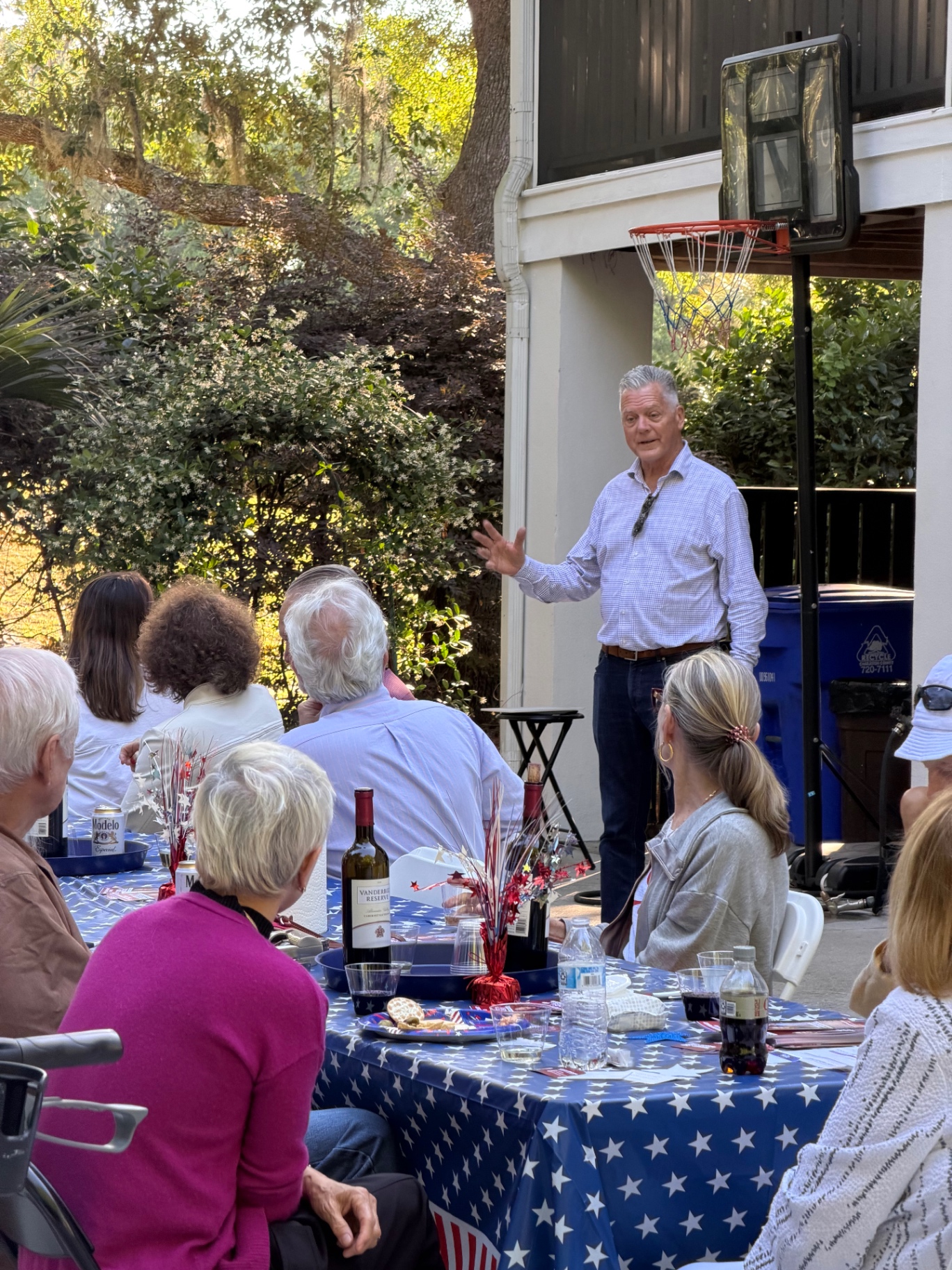 Talking with neighbors at a backyard meet & greet